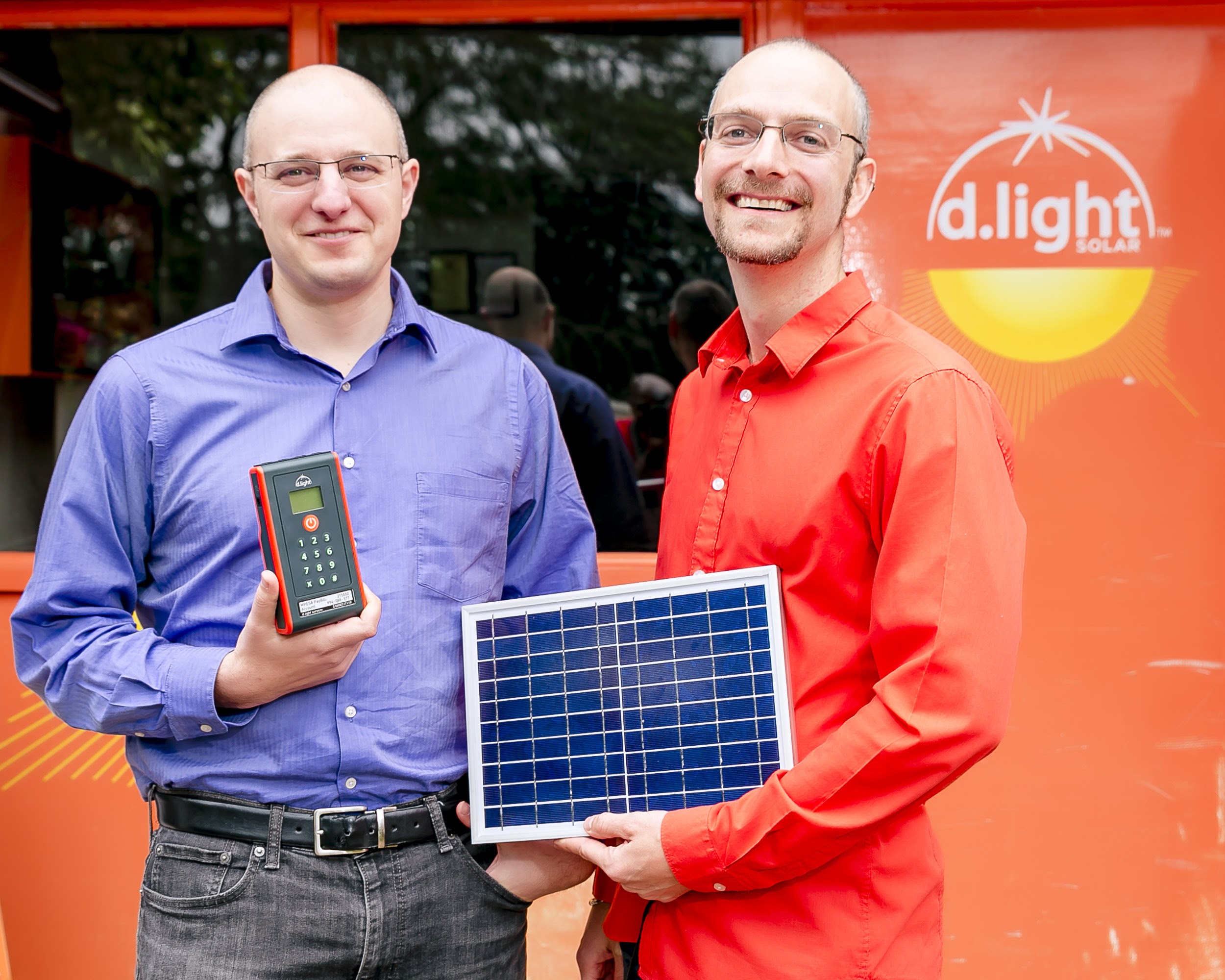 A current shot of co-founders, Ned and Sam, with d.light products. 